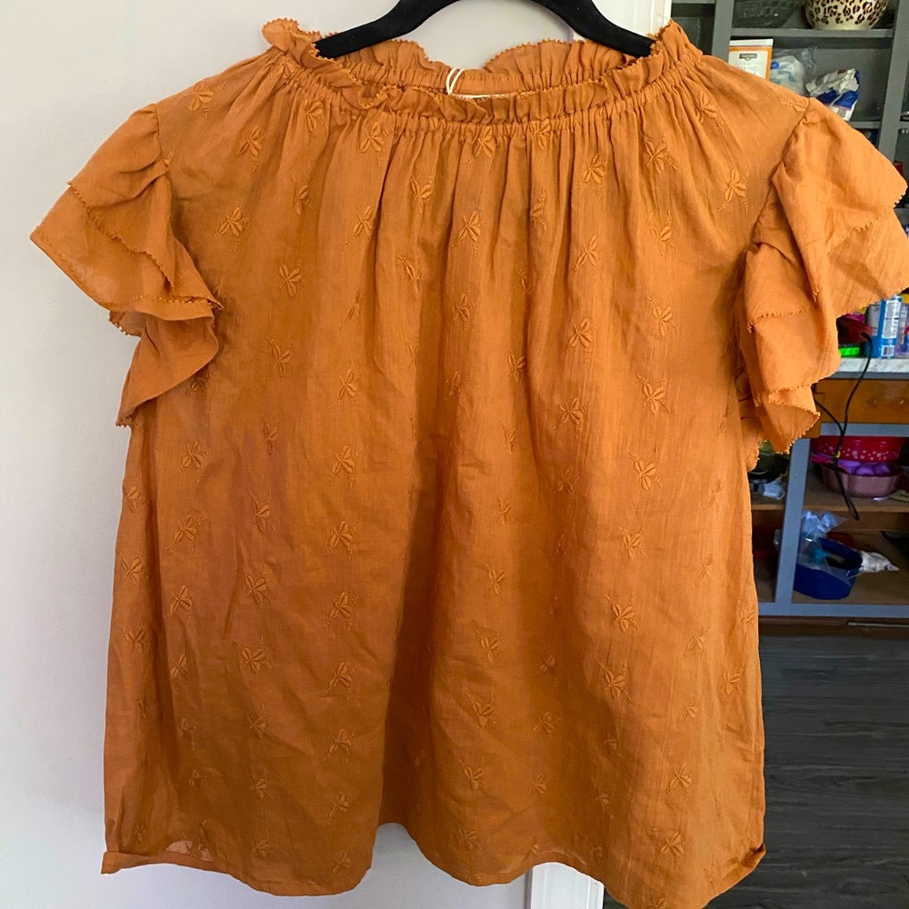 Light orange floral ruffle top